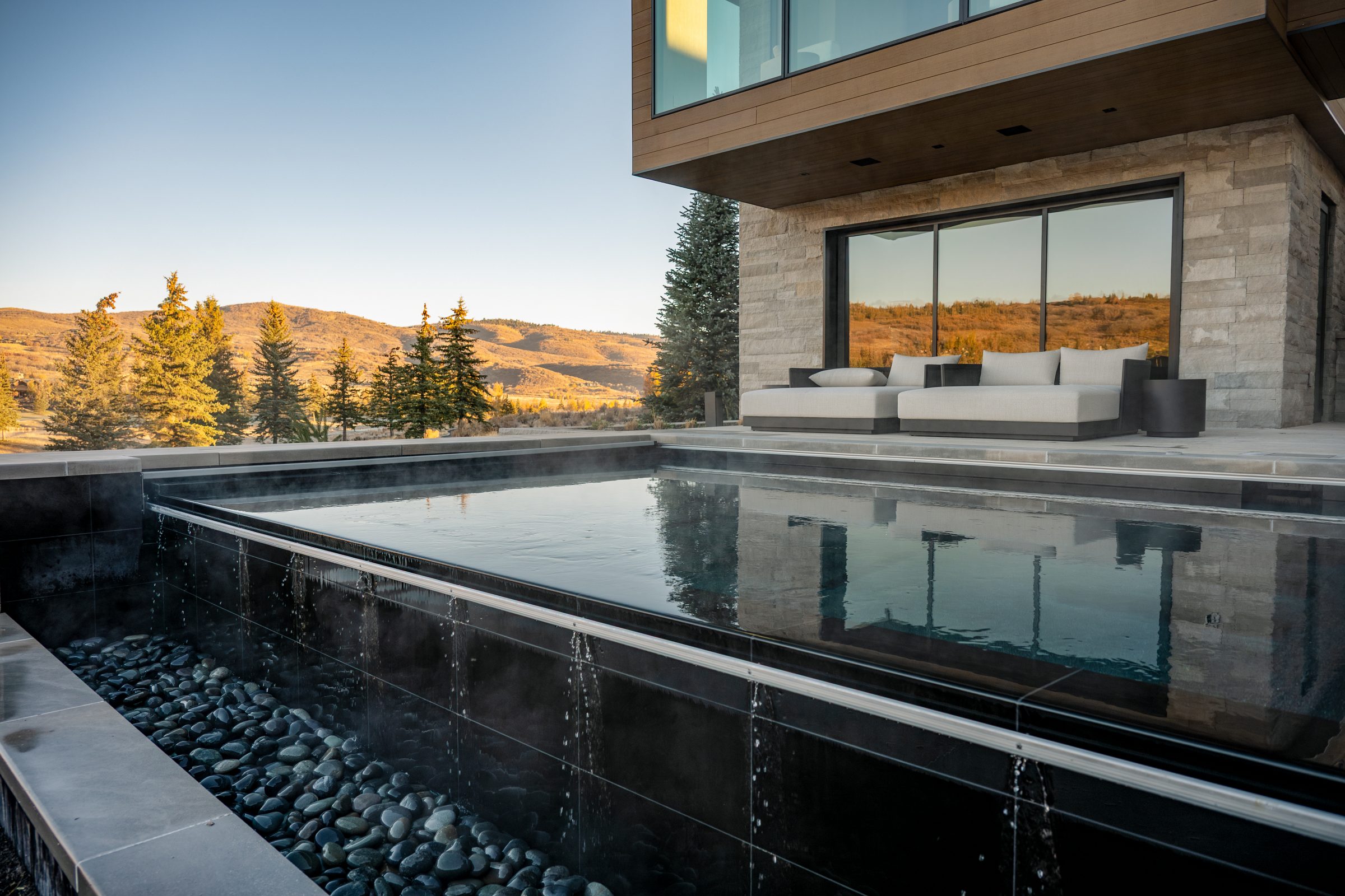 Modern home with pool and mountain view.